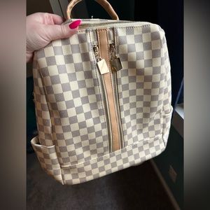 Designer-inspired backpack bag gently used